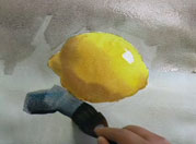 Free watercolor lesson of painting a lemon step-by-step
